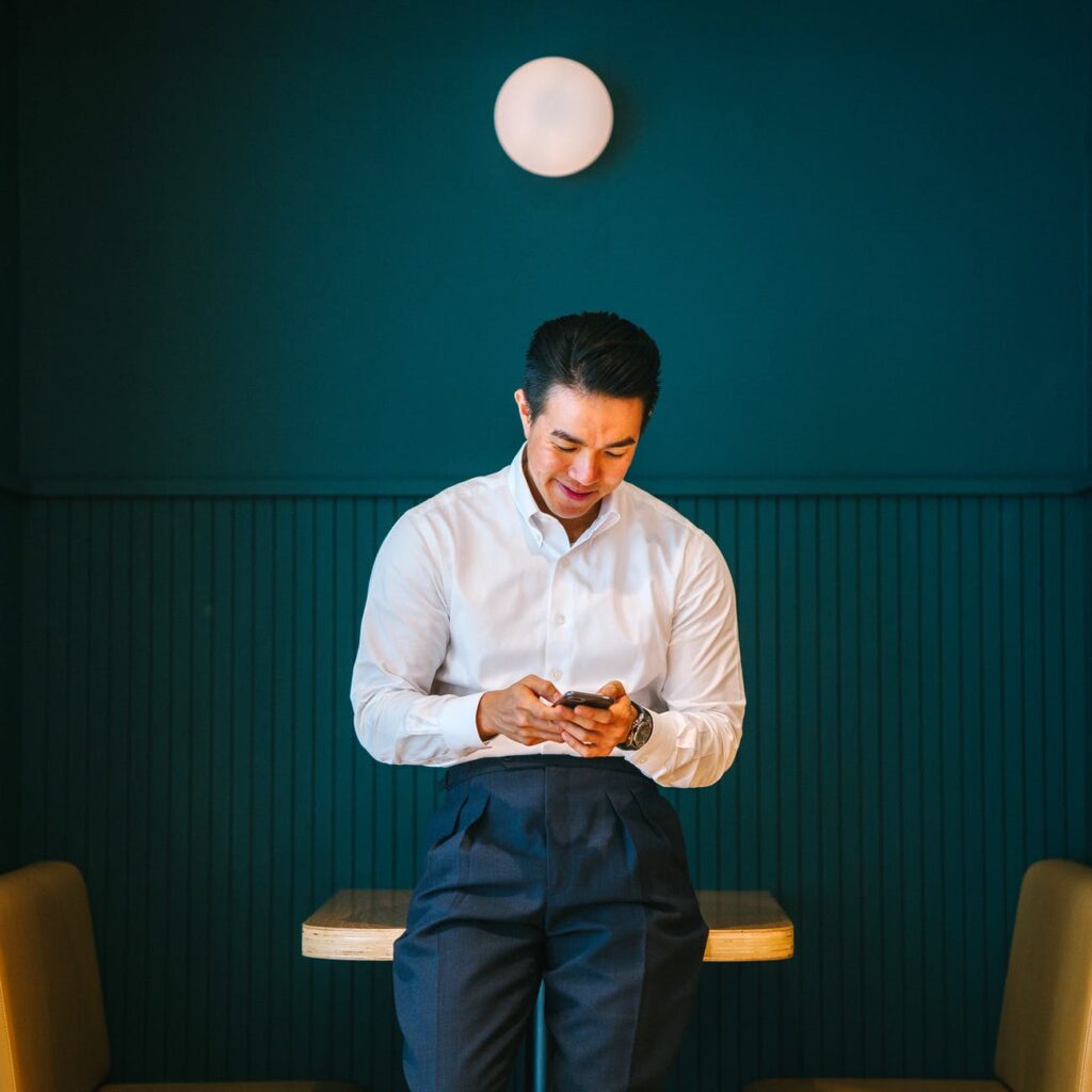 man holding black smartphone